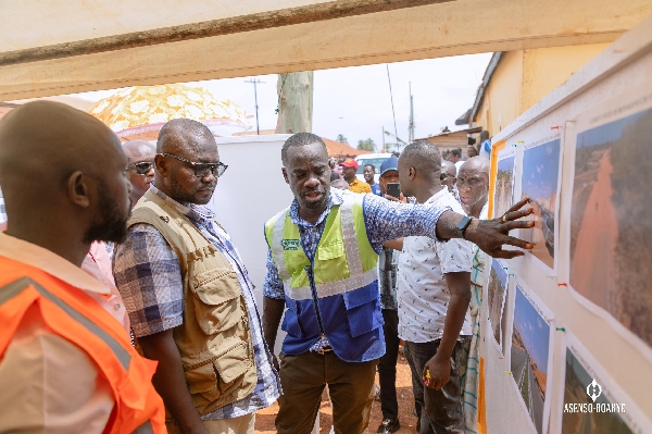 Asenso-Boakye being shown the project plan