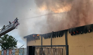 Firefighters battling the blaze at the Dignity DTRT clothing and textile facility