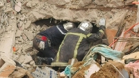 Rescue workers for di site of di accident