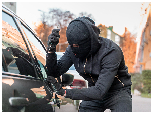 File photo of a man trying to break into a car File photo of a man trying to break into a car