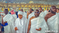 Dr. Mahamudu Bawumia (R) and his wife Samira Bawumia (L) offering prayers