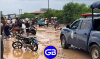 Snippet from video of police chasing after residents to retrieve goods