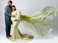 Judikay and her husband with her baby bump