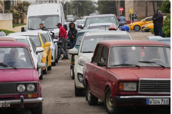 Drivers wait in line to fill up at a gas station in Havana, January 27