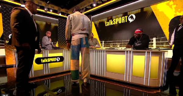 Deontay Wilder was restrained by security after Tyson Fury question