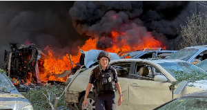 A police officer surveys the site of a Russian attack on a residential area in Zaporizhzhia, Ukraine