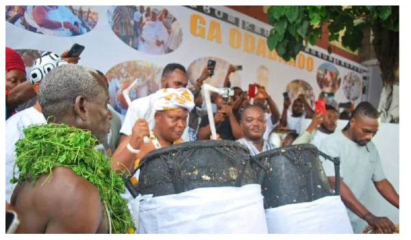 Nii Ayi-Bonte II (1st on drum from left) drumming to lift the ban on noise making