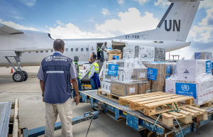 WHO workers in Kenya pack essential medical supplies to support the affected region