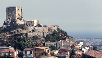 A view of the Castle of Conti D'Aquino and homes in Belcastro, Catanzaro, Italy