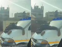 Screenshots from the video of the boy hanging on to the bus