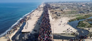 Displaced Palestinians trek towards Gaza City on January 27, 2025