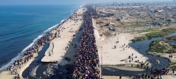 Displaced Palestinians trek towards Gaza City on January 27, 2025