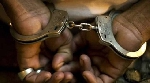 File photo of a person in handcuffs