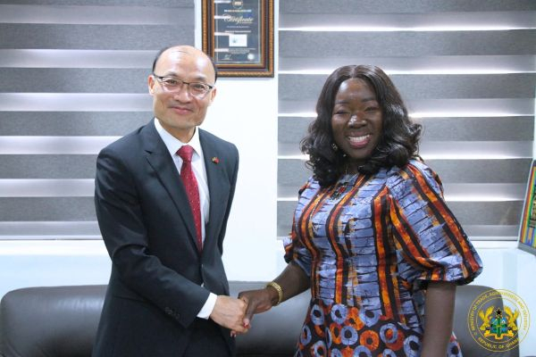Trade minister (R) pictured with outgoing Chinese Ambassador to Ghana