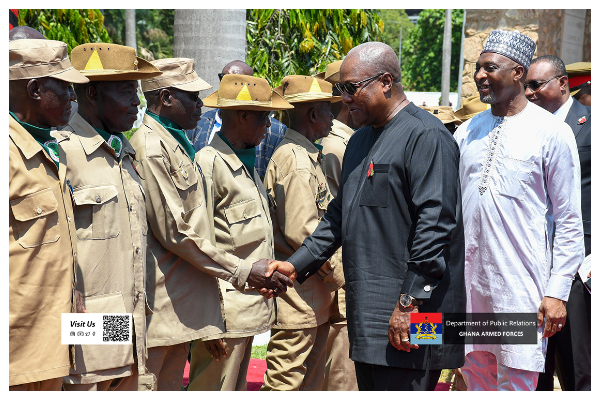 John Dramani Mahama pictured in a handshake with the veterans