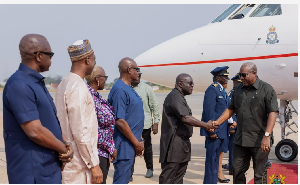 President John Dramani Mahama shaking hands with Julius Debrah