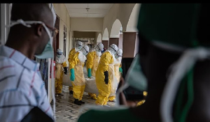 Red Cross workers prepare the body of an Ebola victim at Sofepadi Hospital for burial, in Bunia