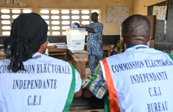 Voters cast their ballots at a polling station in Agboville