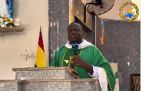 Reverend Fr. Emmanuel Obeng Codjoe preaching to the congregation