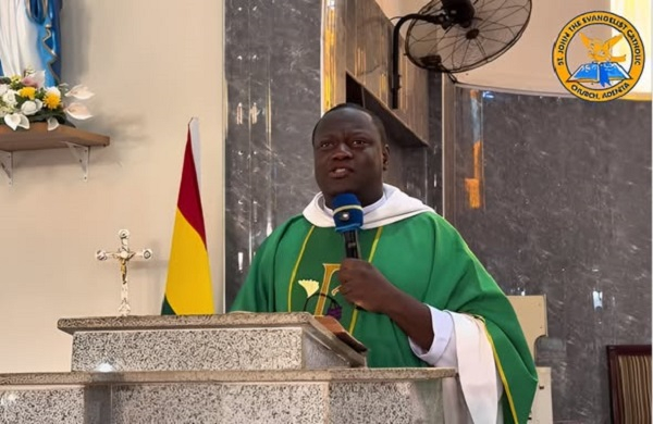 Reverend Fr. Emmanuel Obeng Codjoe preaching to the congregation