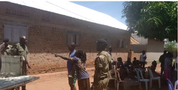 Police at the church to arrest a pastor for keeping patients at the church instead of the hospital