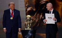 Trump, (L), receives the FIFA Peace Prize from Gianni Infantino during the FIFA World cup draw