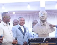 Jose Wise (left) beaming with smiles while watching the statue