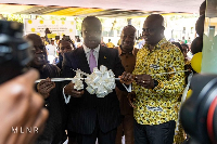 Lands Minister Samuel A. Jinapor (in suit) cutting the ribbon for the opening of the facility