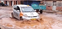 A driver using the deplorable road at Penkwasi