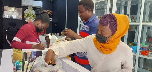 FDA officials inspecting suspected illicit drugs in a shop