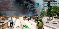 Tanzanian riot police disperse demonstrators during violent protests that marred the election