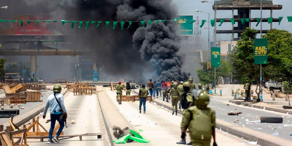 Tanzanian riot police disperse demonstrators during violent protests that marred the election