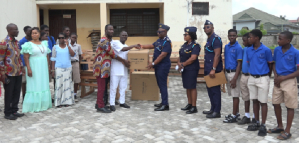 Customs Officials presenting items to students of Baatsona TWMA JHS