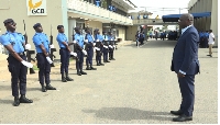 Minister of Finance, Mohammed Amin Adam, inspecting a guard of honour at the Tema Collection