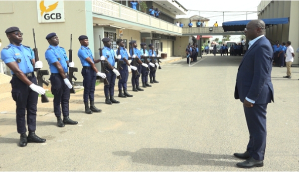 Minister of Finance, Mohammed Amin Adam, inspecting a guard of honour at the Tema Collection