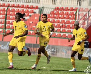 Players of the Black Stars celebrating a goal