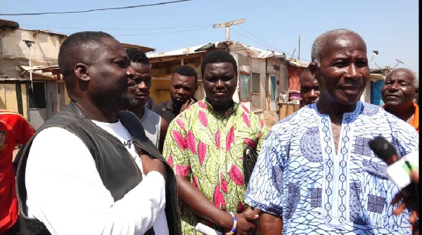 Clemence Gyato (L) among other residents during the operation