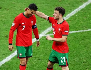 Cristiano Ronaldo (wearing the captain armband) with deceased teammate Diogo Jota