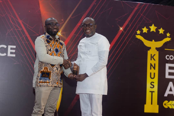 Dr Kingsley Agyemang (R), receiving his award