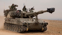 Israel don put more tanks and men for di border wit Gaza