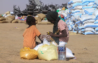 Sudanese girls who fled el-Fasher receive humanitarian aid at the Al-Afad camp
