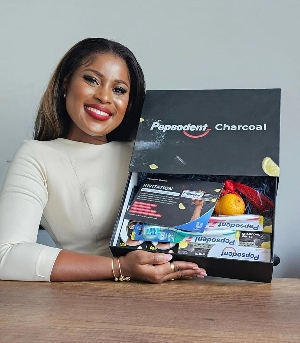 Berla Mundi in a pose with the newly improved Pepsodent charcoal