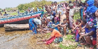Relatives  mourning on the shores of Lake Victoria at Mchigondo Village in Bunda district