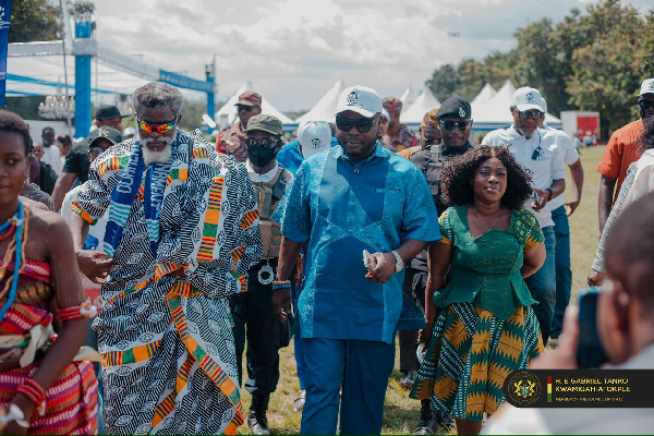 Dr Kwamigah-Atokple, flanked by his wife arriving at the event grounds at Dzodze