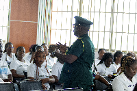 An immigration Officer interacting with the students