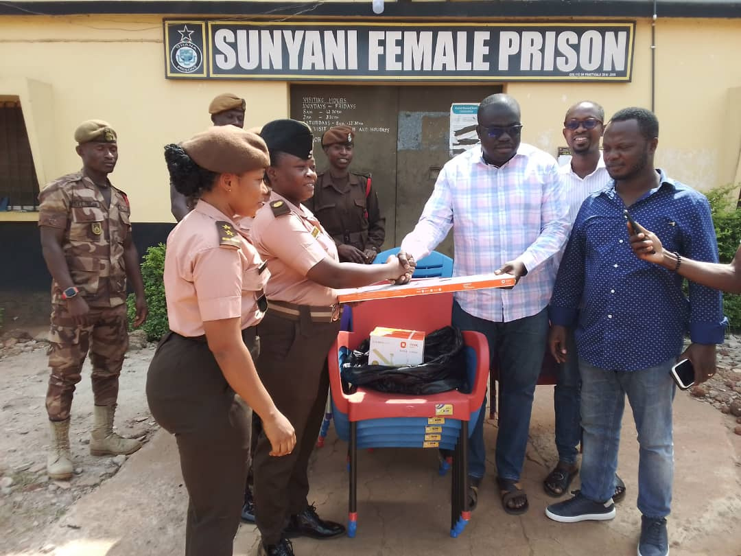 The MP (right) making a donation to the Sunyani Female Prisons