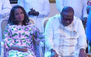 Archbishop Duncan-Williams being consoled by his wife after Rosemond Anaba was praising him