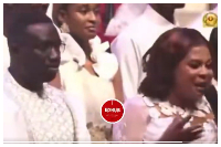 A photo of the couple speaking at a thanksgiving service at church