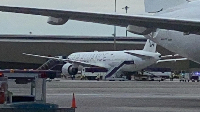 A Singapore airline aircraft is seen on tarmac after requesting an emergency landing