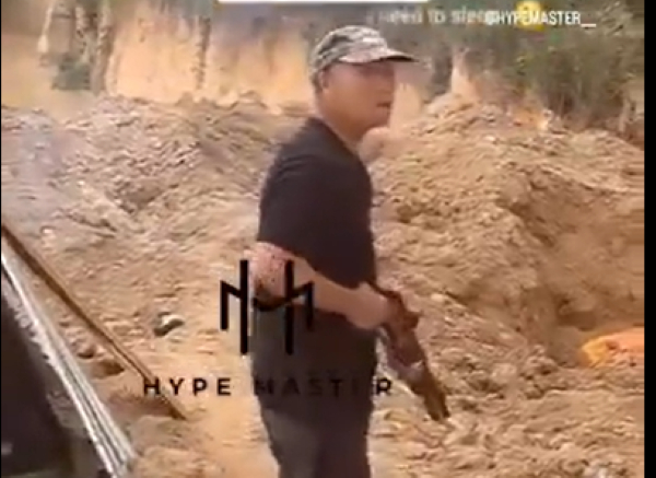 The Chinese man was captured pointing the weapon at Emma